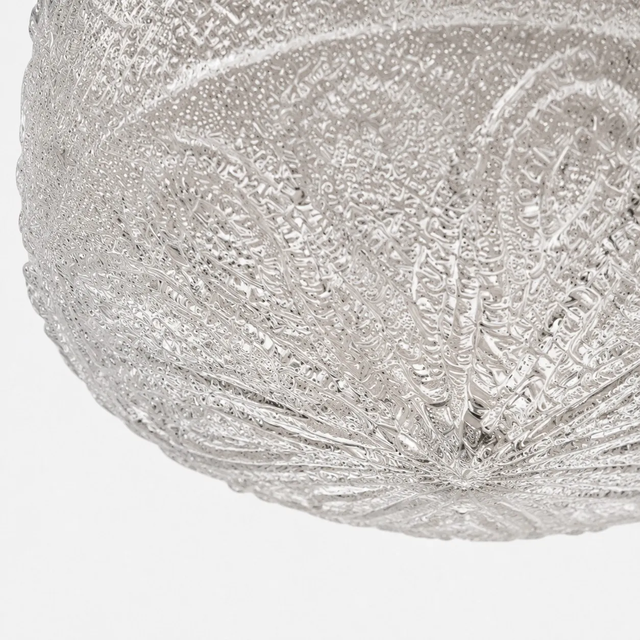 Textured glass relief close-up on flush mount ceiling light