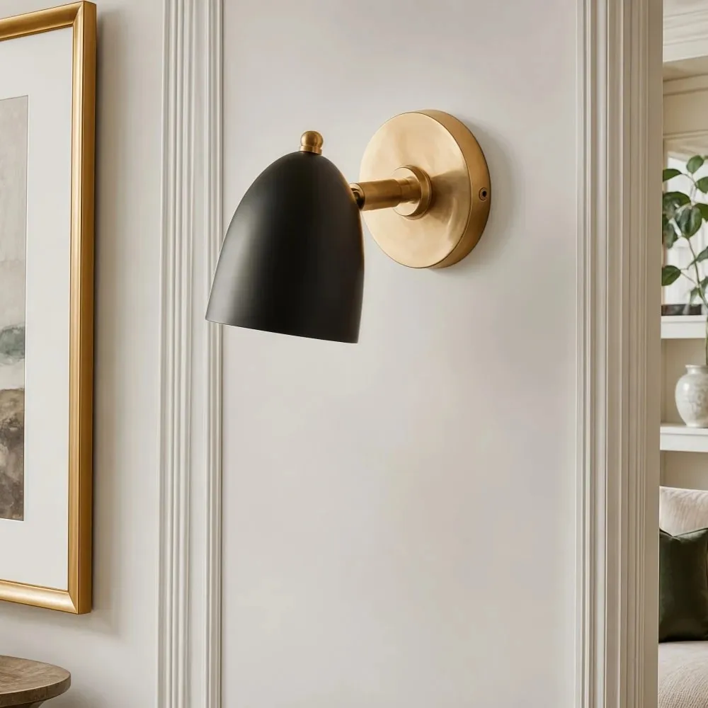 Black and gold wall sconce on a refined wall