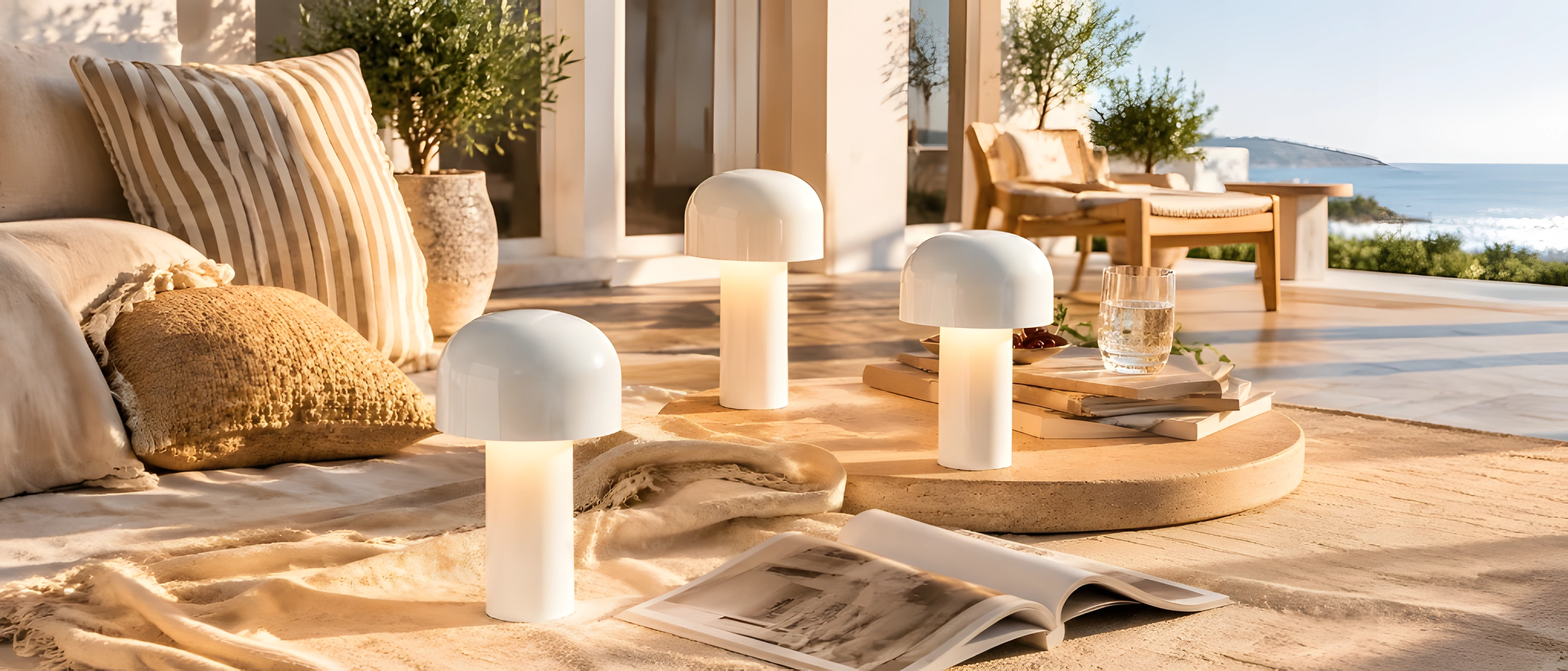 White mushroom dome table lamps on an outdoor daybed