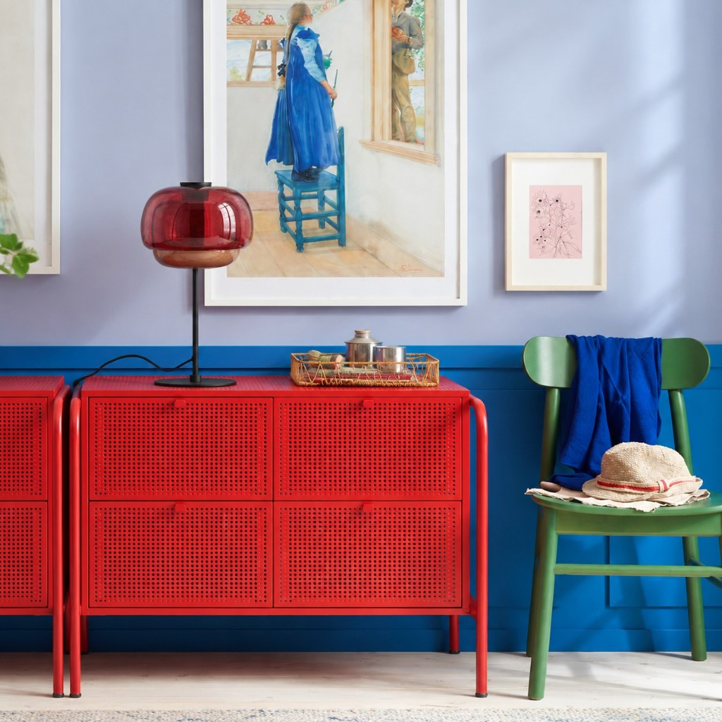 Burgundy double-dome glass table lamp on a red cabinet