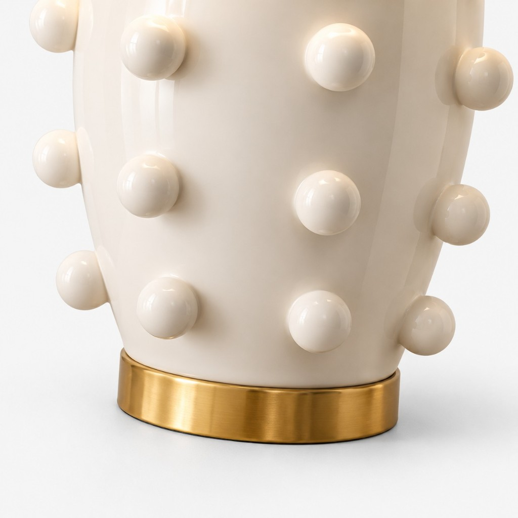 Brass foot under the raised-dot ceramic body