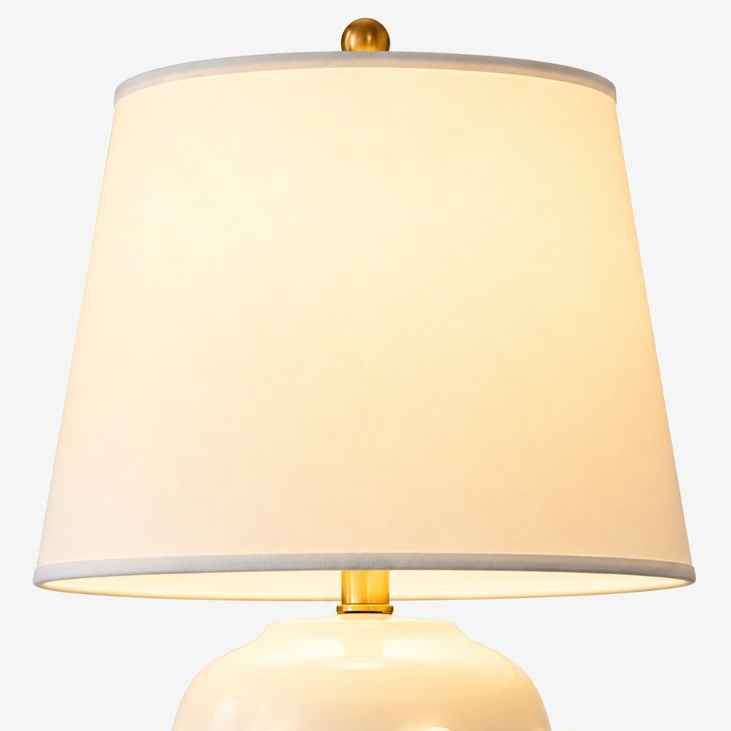 Off-white tapered linen shade and brass finial