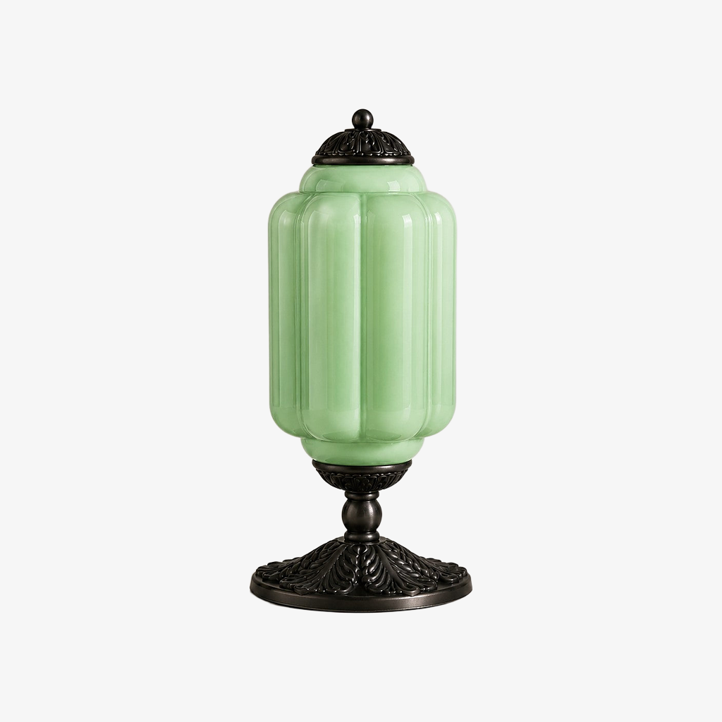Green scalloped glass table lamp with a black base