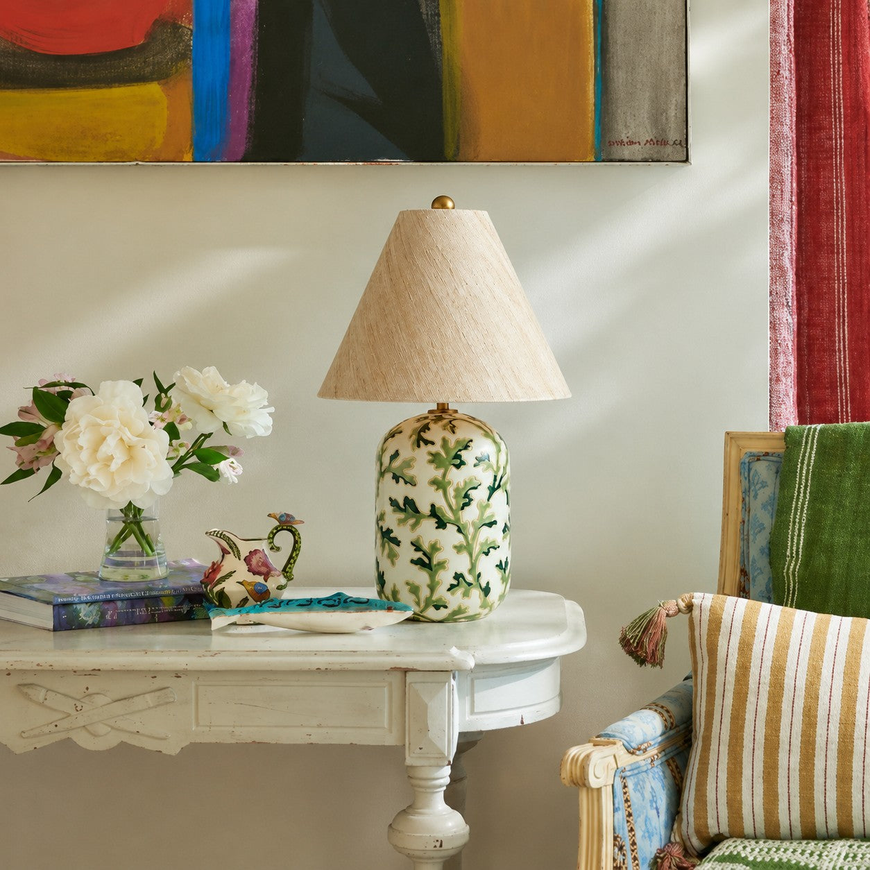 Green tapered linen shade table lamp in a living room