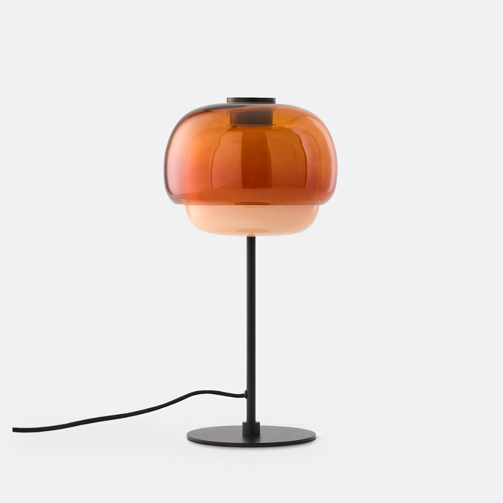 Orange double-dome glass table lamp with a black base