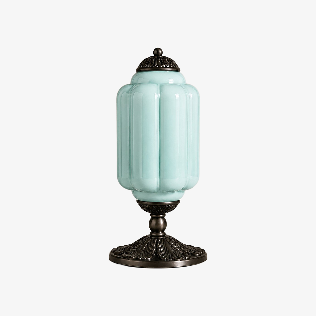 Blue scalloped glass table lamp with a black base