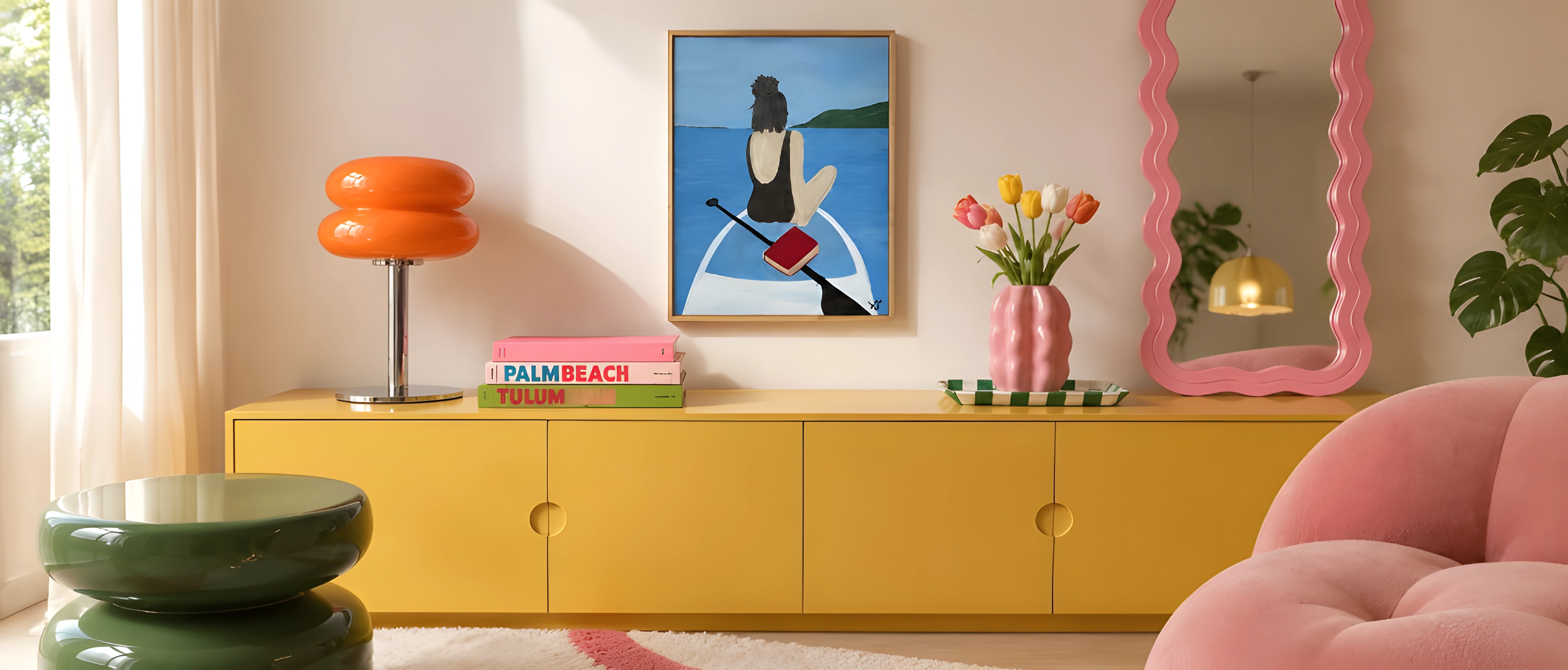 Orange two-tier glass table lamp on a yellow sideboard