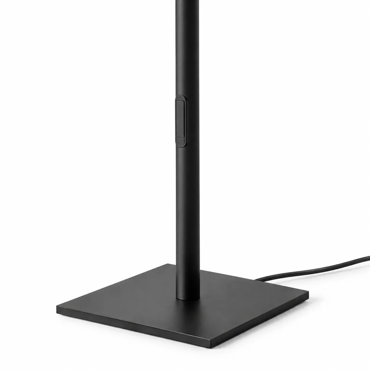 Square base and cord of a black Ilio Mini floor lamp