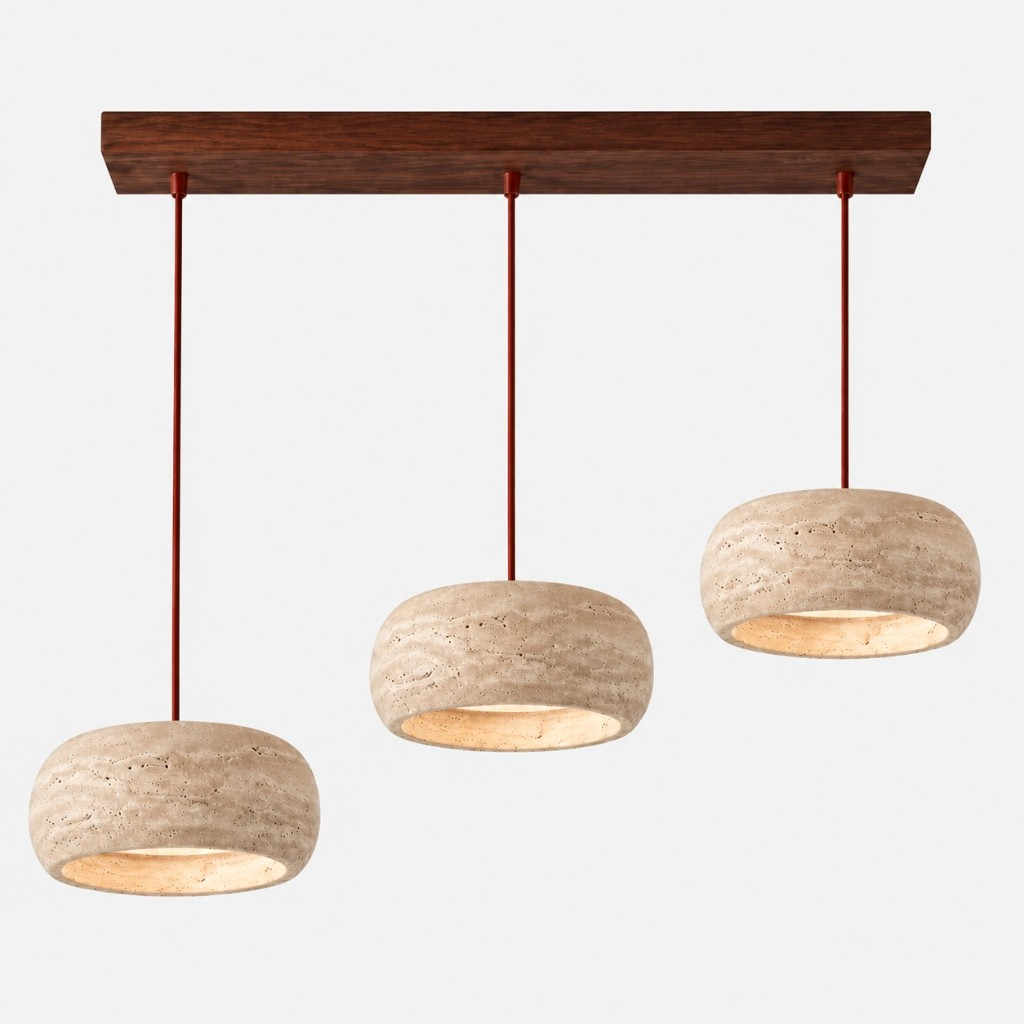 Three large cream travertine rounded pendants on a walnut bar