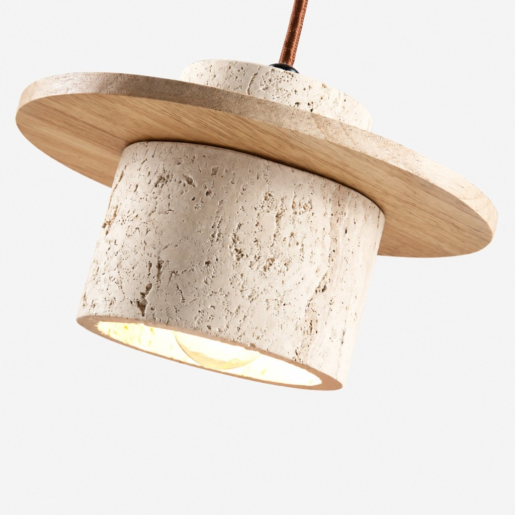 Angled view of the travertine shade and wood disc