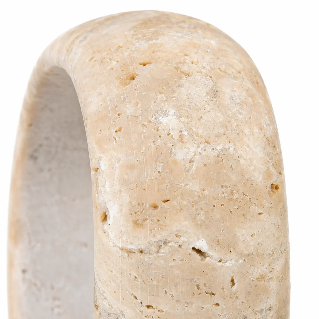 Close view of the cream travertine surface