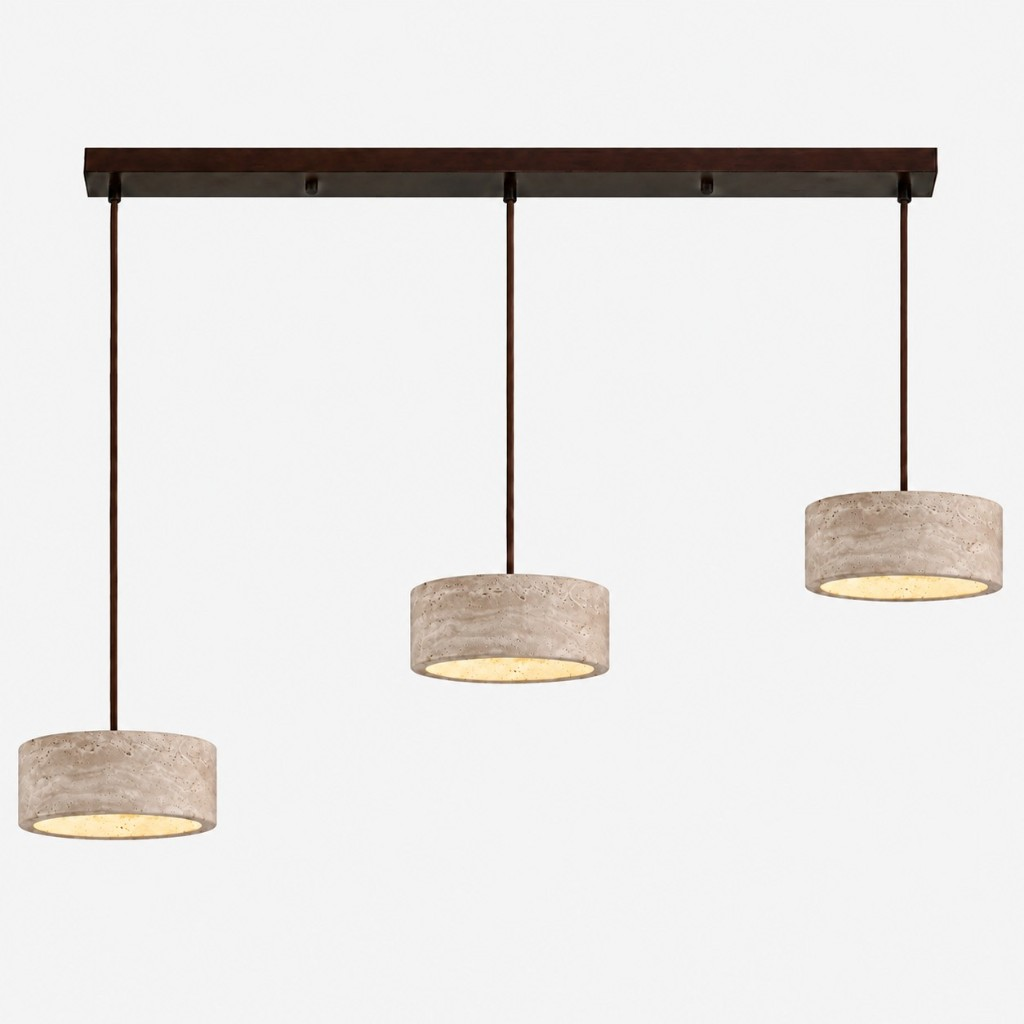 Three smaller cream travertine drum pendants on a dark bar