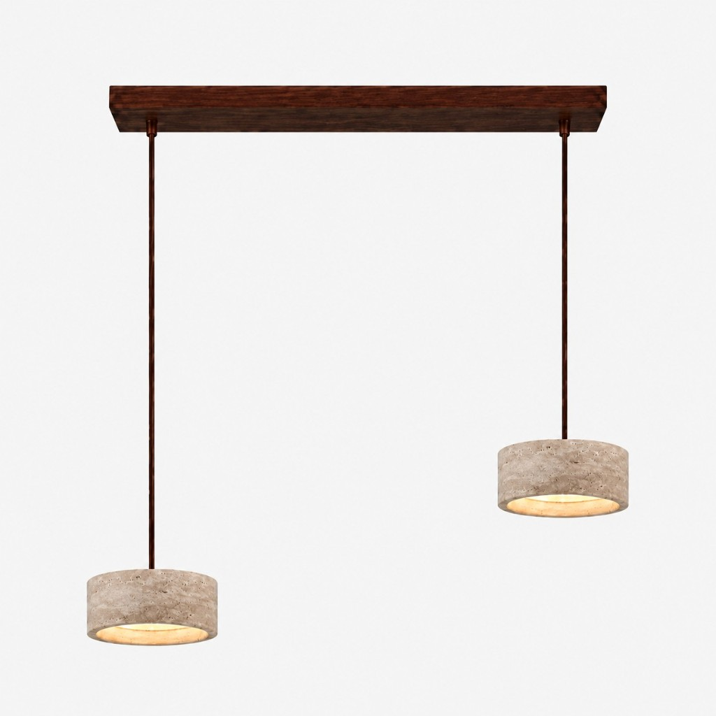 Two smaller cream travertine drum pendants on a walnut bar
