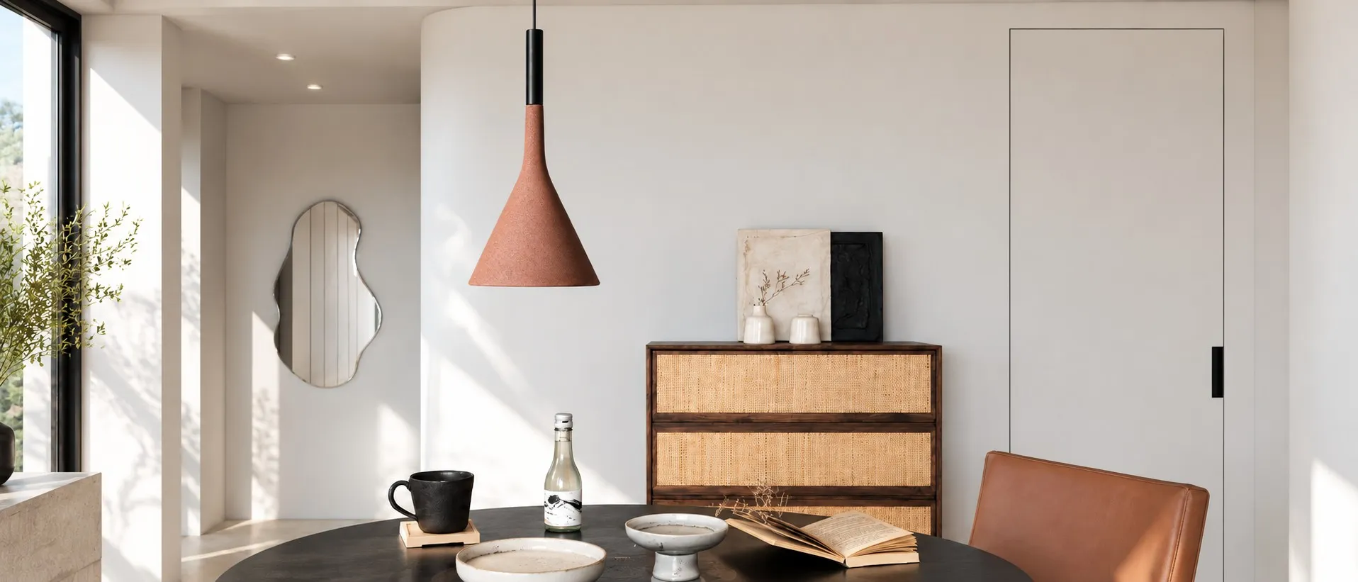 Alphomo brick red conical pendant above a dining table