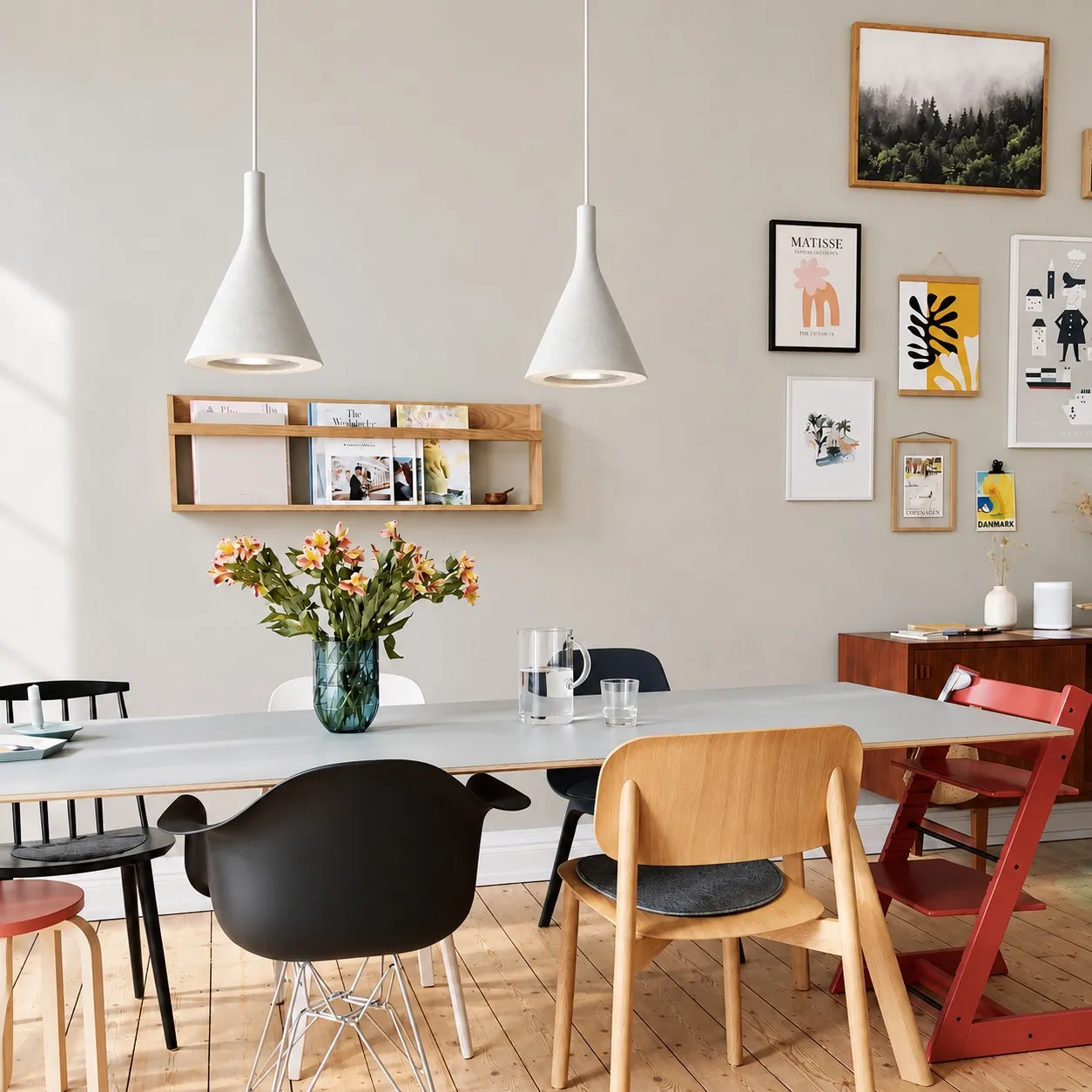 White conical pendants above a dining table